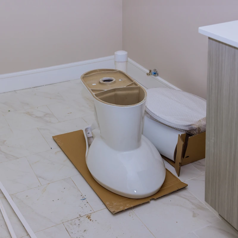 preparing to install toilet in new residential home